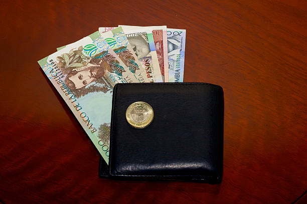 istock Colombia money into black leather wallet 471865453