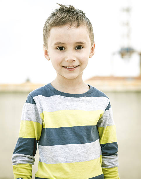 istock Young boy in a striped colored T-shirt 471865764