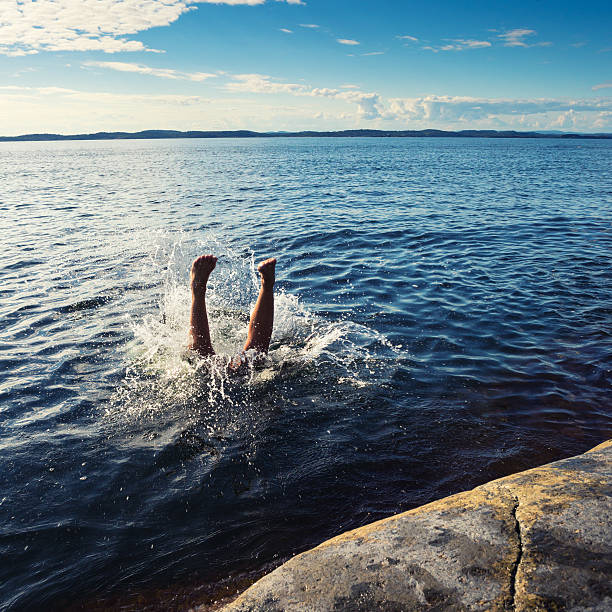 istock Woman diving, legs and splash, Vestfold Norway 471865827