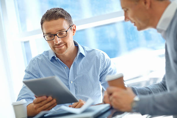 istock Reading the business updates online 471866927