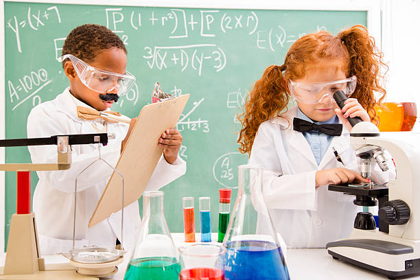 educación y ciencia: retro niños jugando en los científicos. - child back to school mustache african ethnicity fotografías e imágenes de stock