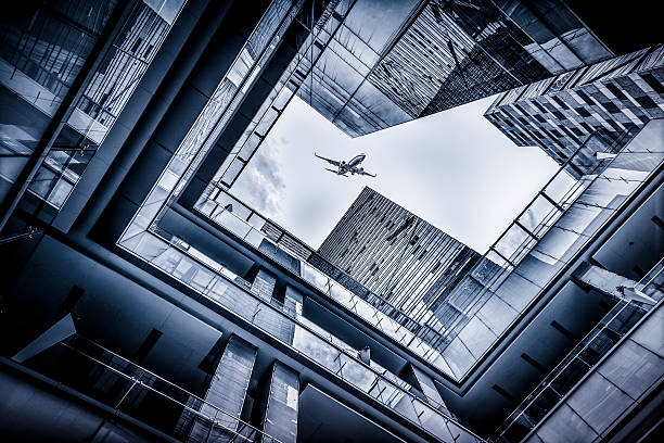 istock Skyscrapers with airplane 471867881