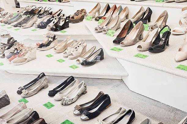 Shoes in a shop window with sales