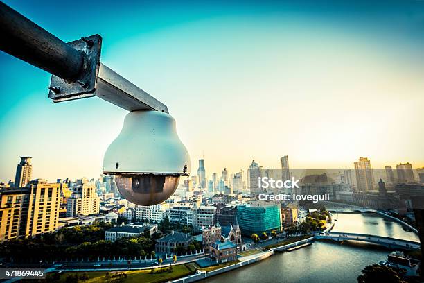 Cctv Over City Stock Photo - Download Image Now - Security Camera, Building - Activity, Building Exterior