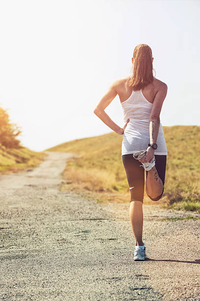 istock Woman stretching before running on outdoor trail 471870685