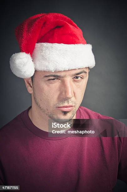 Young Man Making A Face Christmas Portrait Stock Photo - Download Image Now - 20-29 Years, 25-29 Years, Adult