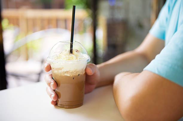 istock Person Holding Iced Coffee 471871333