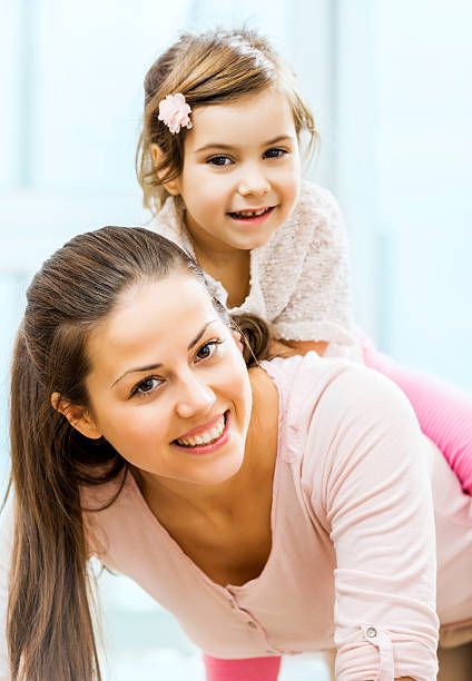 istock Mother piggybacking her cute daughter. 471871471