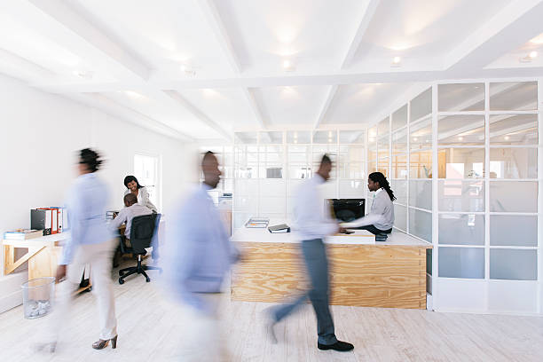 Busy African office with people walking around.