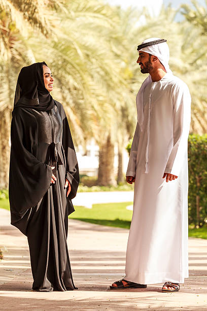 istock An arab couple are walking in a park. 471871626