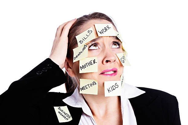 istock Exasperated woman covered in reminders rolls her eyes 471872157
