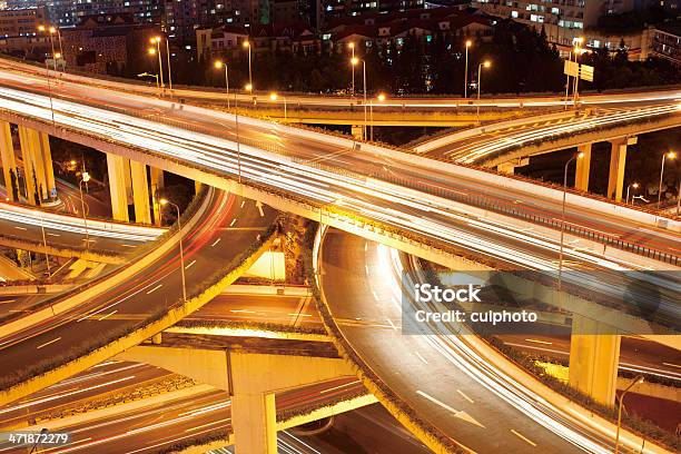 Freeway Interchange Heavy Traffic At Night Stock Photo - Download Image Now - Merging, Highway, Single Lane Road
