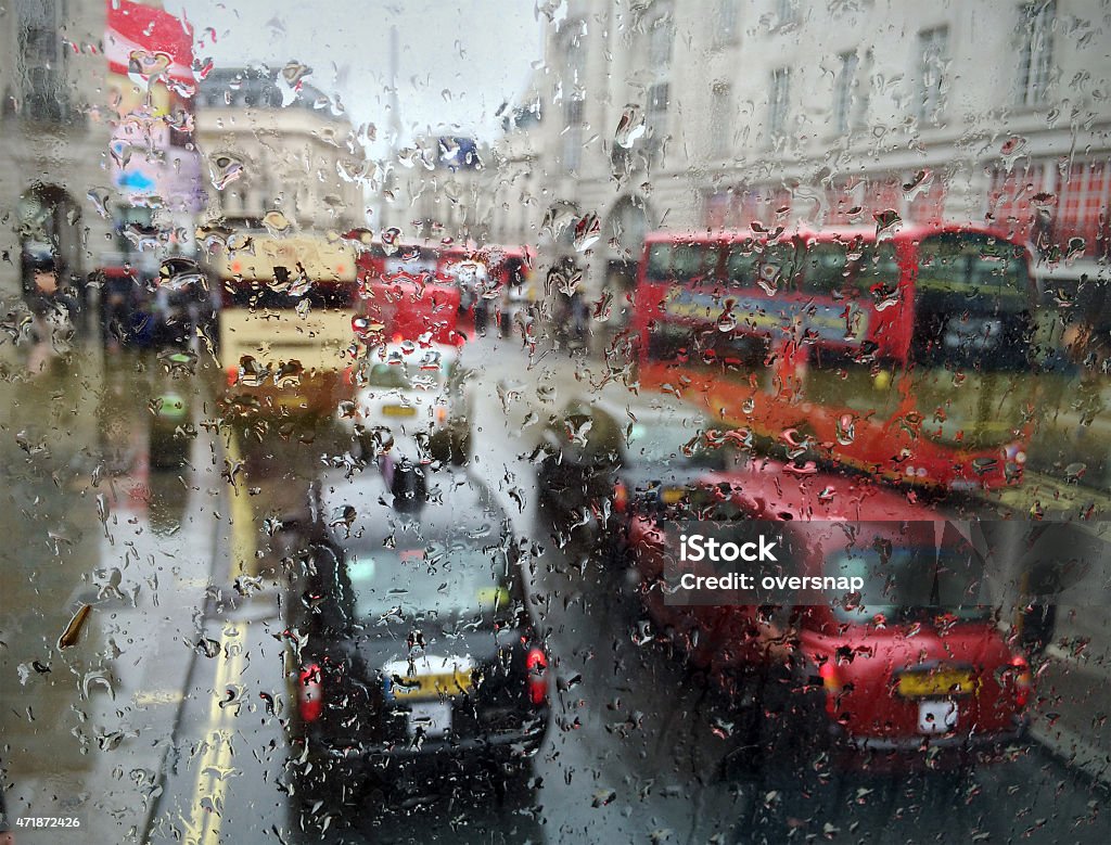 Impressionistic London Rain Abstract image of raindrops on a bus windshield with impressionistic (out of focus) central London traffic around Piccadilly Circus Traffic Jam Stock Photo