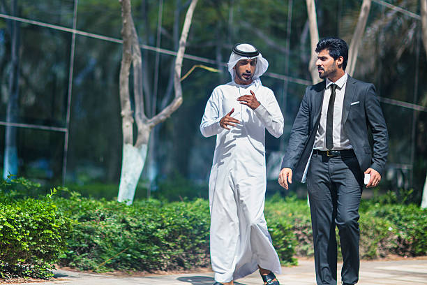 istock Middle Eastern businessmen talking in the street 471872606