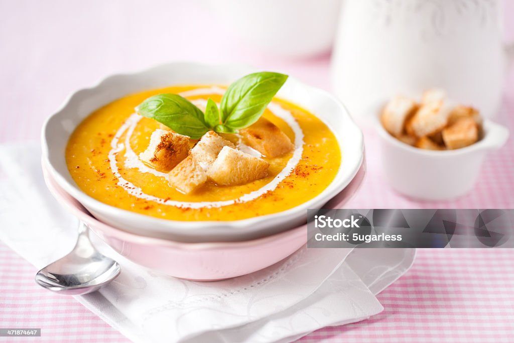 Pumpkin soup with croutons and basil Pumpkin soup with croutons, cream and basil Course - Meal Stock Photo