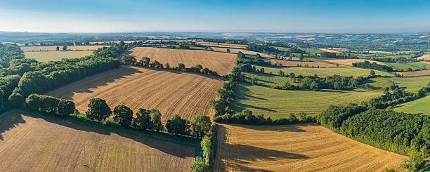 istock Idyllic rural landscape of patchwork fields pasture aerial panorama 471874895