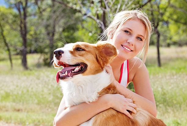 istock Young Woman With Dog 471875637