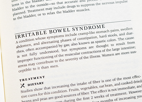 Close up of a mass produced, generic book with a description of Irritable Bowel Syndrome.  