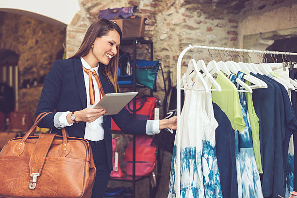 istock Smiling businesswoman shopping 471876548