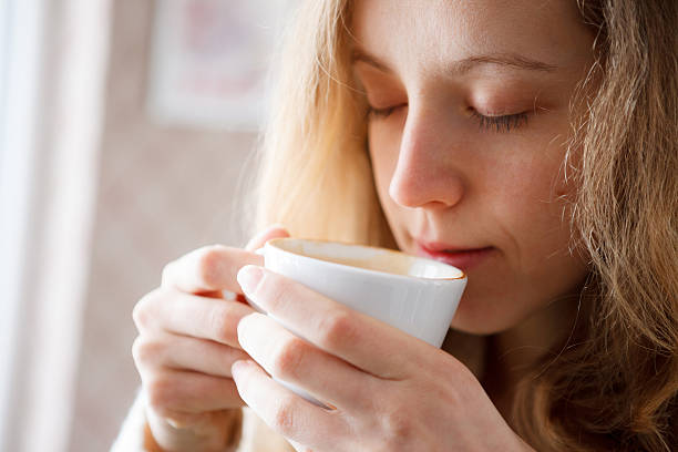 istock Beautiful girl drinking coffee. Cup of hot beverage 471877049