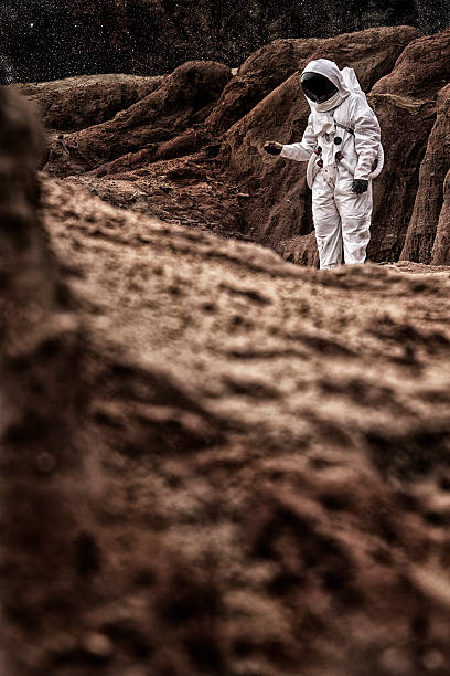 istock Astronaut Walking On Mars or the Moon 471877173