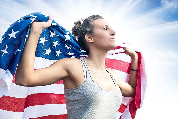 istock Beautiful US athlete with national flag 471877399