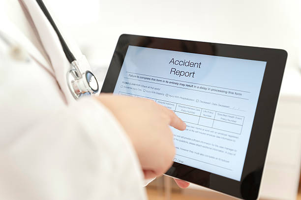 istock Doctor with Accident report form 471878317