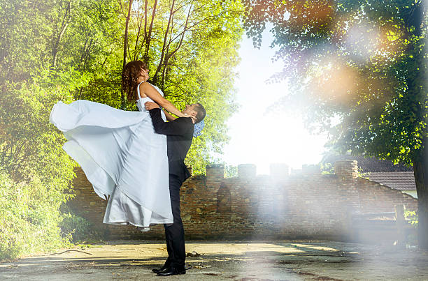 istock playful wedding couple 471878723