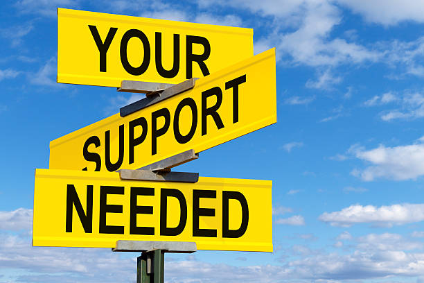 Your Support Needed Street Sign Your Support Needed Street Sign dependency photos stock pictures, royalty-free photos & images