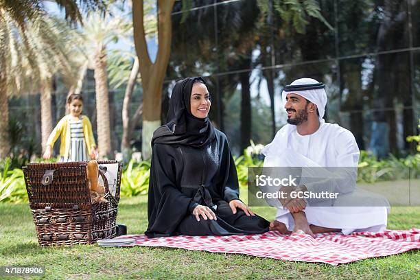 An Arab Family With Their Daughter In A Park Stock Photo - Download Image Now - Arabic Style, Defocused, Family