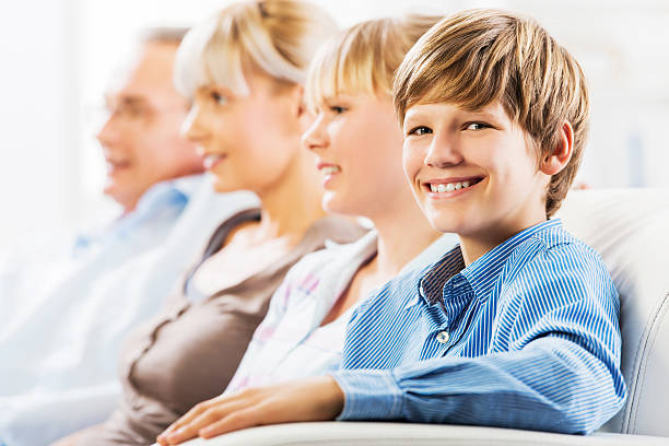 istock Cheerful family sitting in a row. 471879259