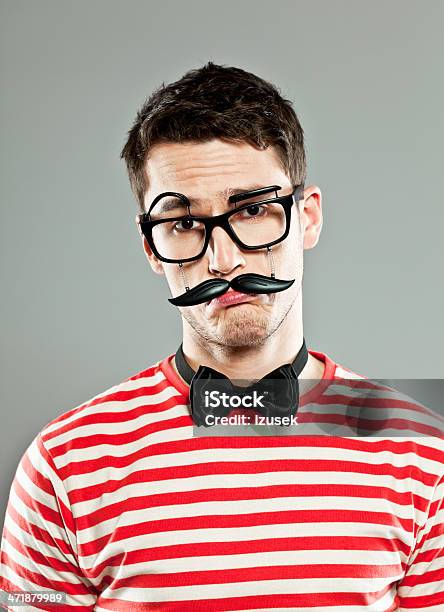 Sad Man Wearing Fake Mask Stock Photo - Download Image Now - Young Men, 20-24 Years, Adult