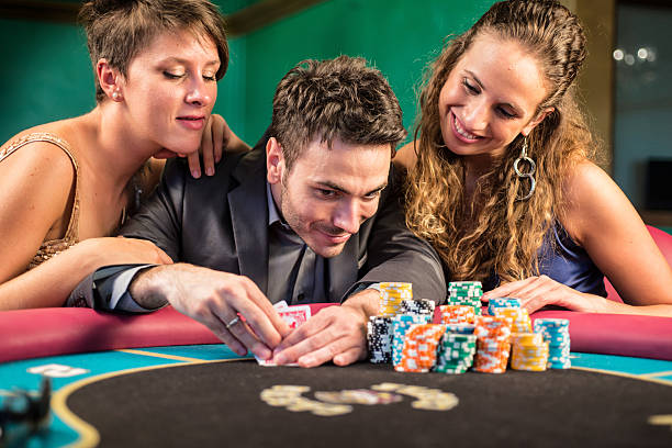 istock Casino. Poker Player Checking His Cards 471880093