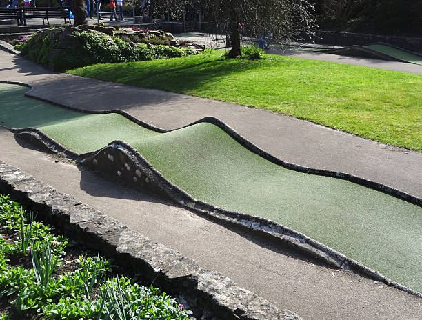 istock Image of children playing on miniature crazy golf course / mini-golf 471881080