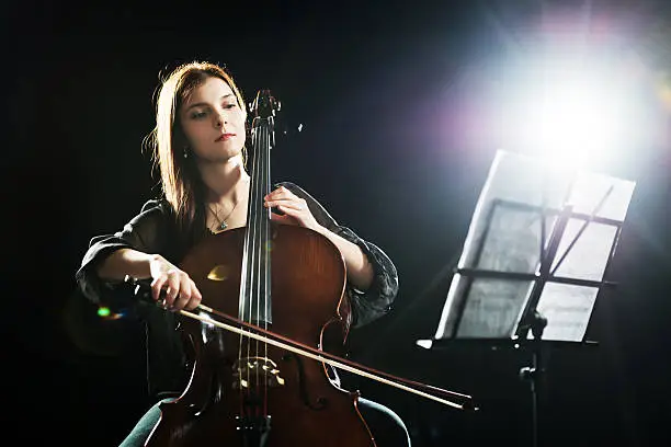 Beautiful female playing cello.
