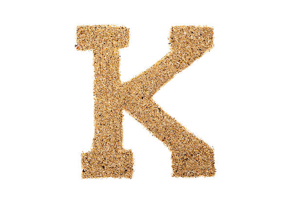 istock Letter K made of sand 471882220