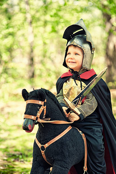 istock Little knight riding through the woods 471882371