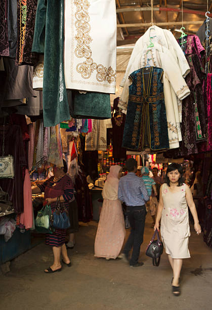 Bishkek, Kyrgyzstan - September 7, 2013: Osh Bazaar is one of the largest bazaars in Bishkek, Kyrgyzstan. It's located on the west side of town, and is not far from the Western Bus Station. At Osh bazaar, one can buy food products, almost any common household good, clothes, Kyrgyzstan souvenirs, and even musical instruments. Local people are shopping.