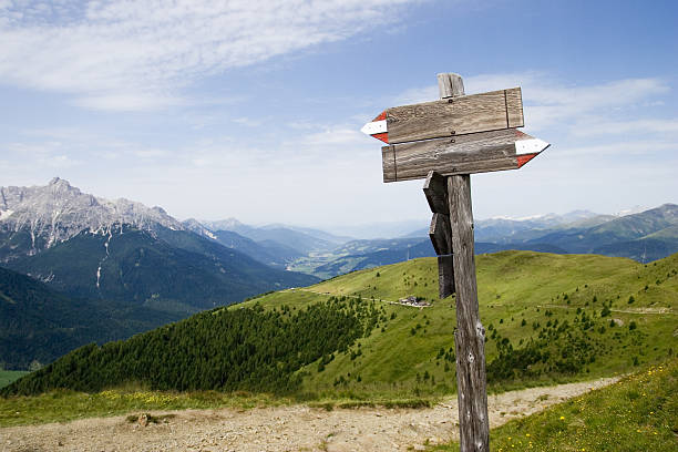 Empty trail sign in the Alps Empty wooden signs in a moutain panorama hiking sign stock pictures, royalty-free photos & images