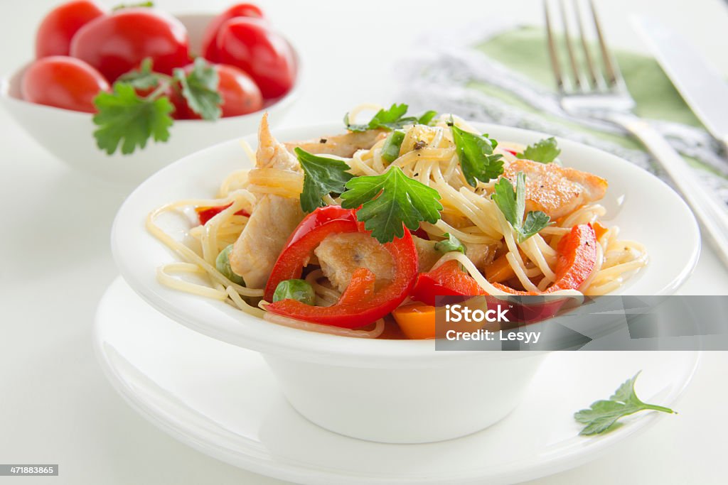 Pasta with chicken and vegetables. Carrot Stock Photo