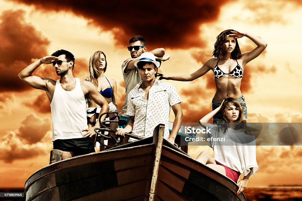 Group Of Friends In Boat Group of young friends in fishing boat, ready for adventure. Movie Stock Photo