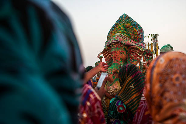 istock Indian Hindu Devotees carry Ganesh Idol 471885711
