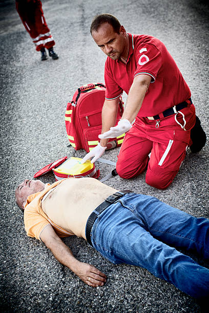 istock Paramedics succor a man with heart attack 471885719