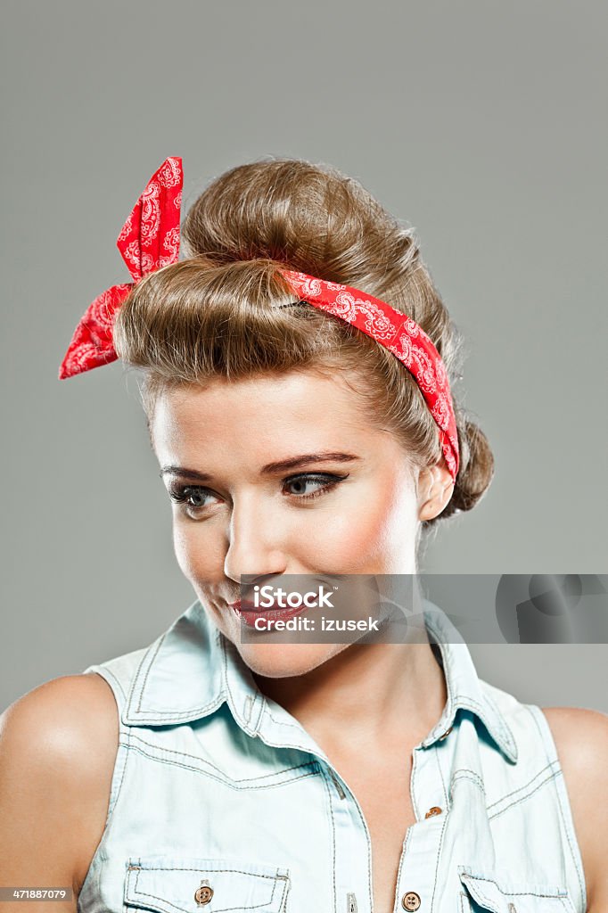Pin-up style woman, Studio Portrait Portrait of smiling pin-up style young woman. 20-24 Years Stock Photo