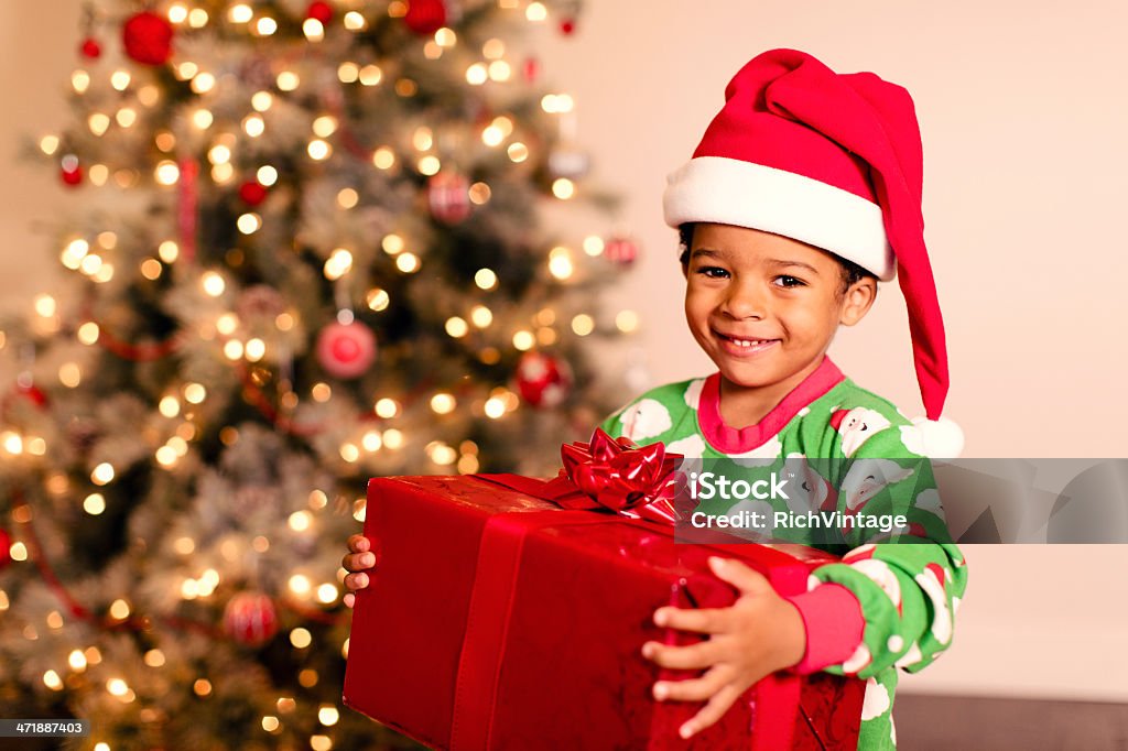 Christmas Morning A young boy is excited for Christmas morning and the opening of presents. Child Stock Photo