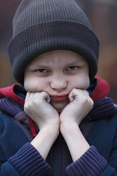 istock dramatic portrait of a homeless boy 471887646