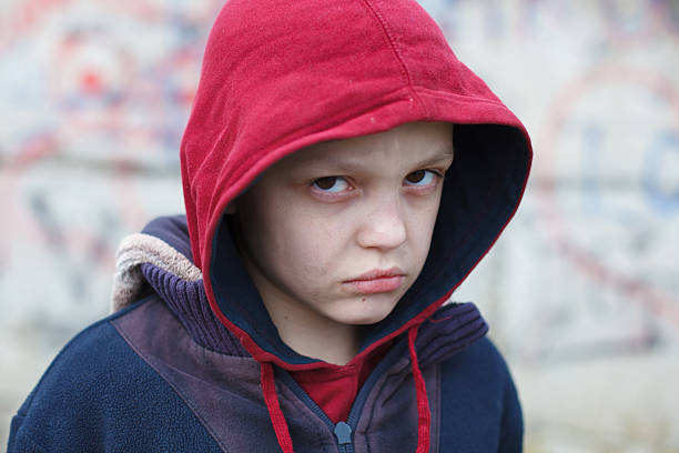 istock dramatic portrait of a homeless boy 471887650