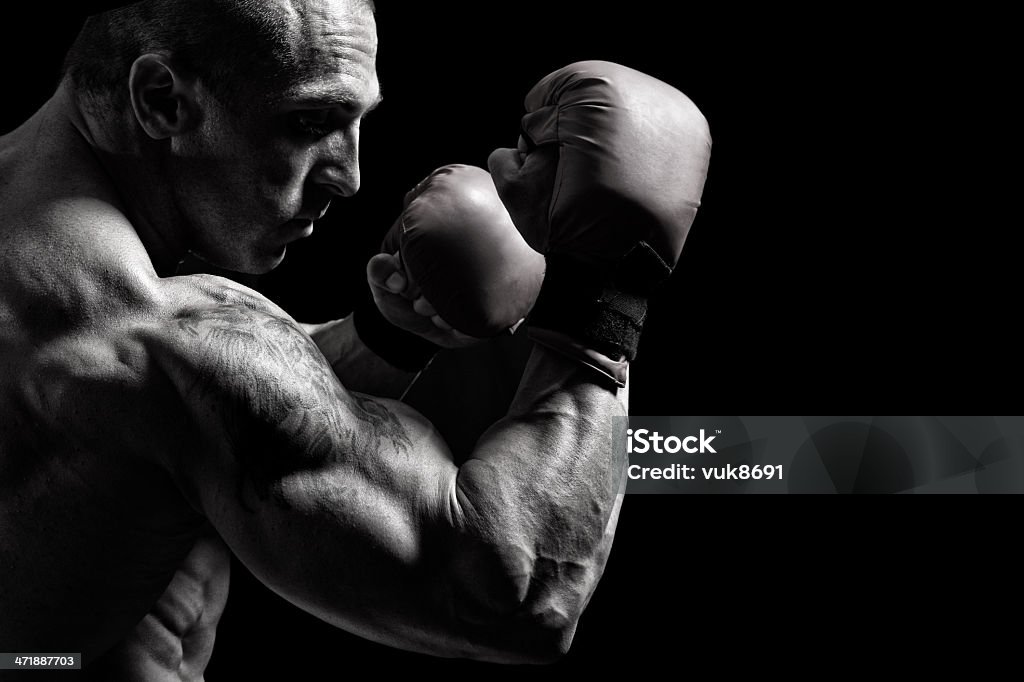 Powerful fighter Powerful fighter portrait-isolated on black background Abdominal Muscle Stock Photo