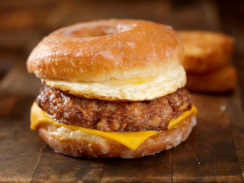 Glazed Donut Breakfast Sandwich with a Sausage Patty, Cheese and an Egg. Made famous this summer by one of the largest donut chains in the US.-Photographed on Hasselblad H3D2-39mb Camera