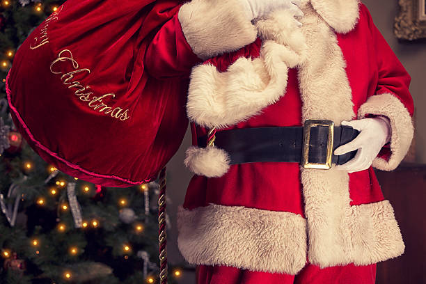 istock Real Santa Claus with bag over his shoulder 471887885